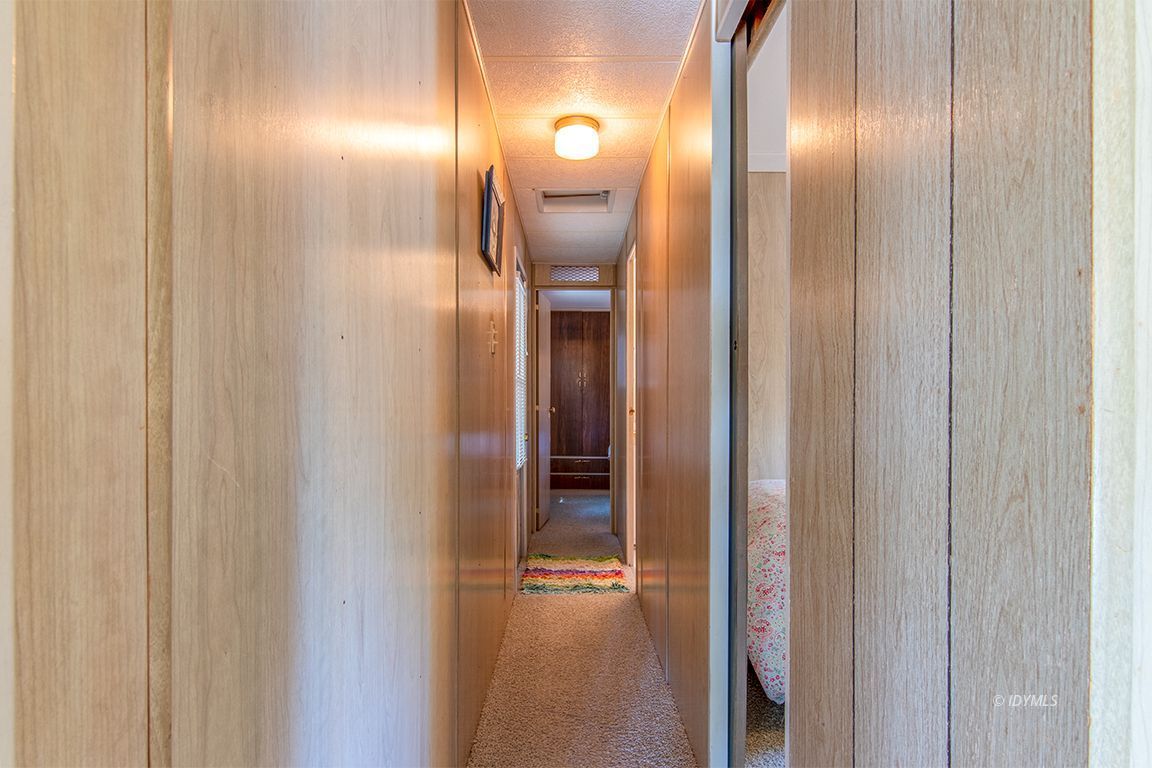 52901 Pine Cove Road, Unit 5 Idyllwild, CA 92549 - Photo 33 of 35 a view of a hallway with wooden floor