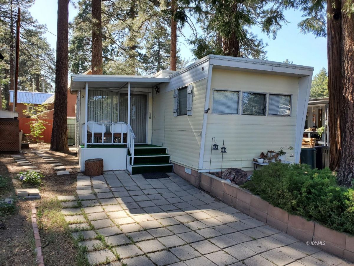 52901 Pine Cove Road, Unit 5 Idyllwild, CA 92549 - Photo 34 of 35 a view of house with backyard outdoor seating and trees
