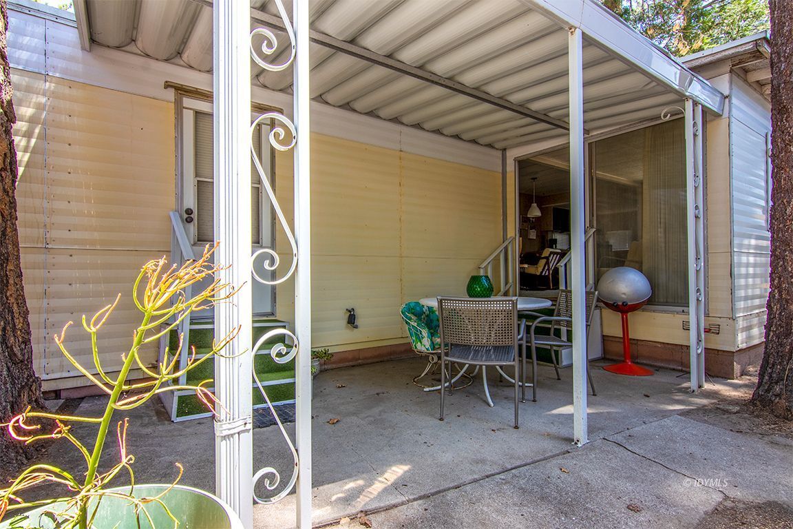 52901 Pine Cove Road, Unit 5 Idyllwild, CA 92549 - Photo 7 of 35 a backyard of a house with table and chairs
