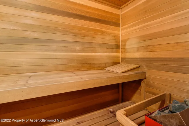 a outdoor dining space with furniture and umbrella