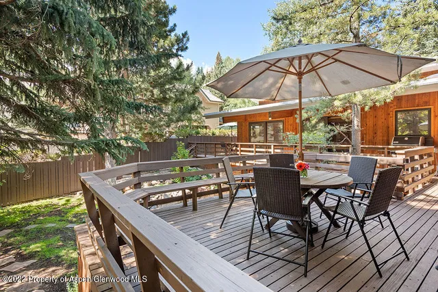 swimming pool view with a seating space