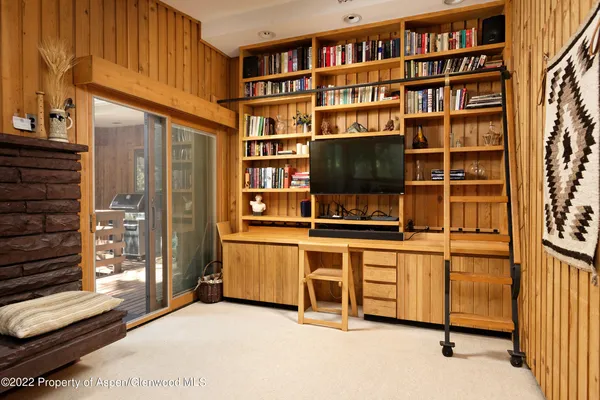 a dining room with furniture window and outside view