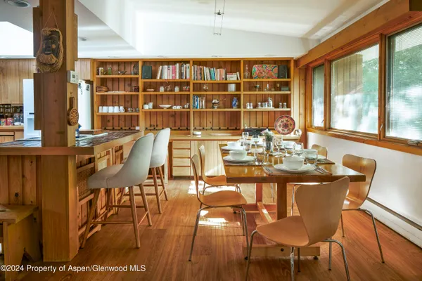 a view of kitchen with windows and refrigerator
