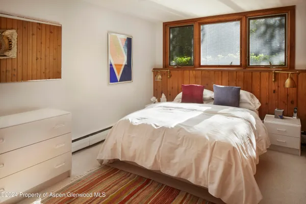 a bathroom with a sink vanity mirror and toilet