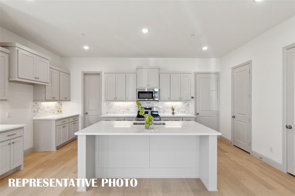 1401 Rooted Road Frisco, TX 75033 - Photo 4 of 15 A dream kitchen that is beautifully finished and offers everything you have been searching for! REPRESENTATIVE PHOTO