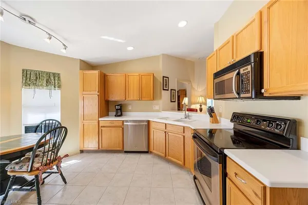 a kitchen with a sink cabinets and window