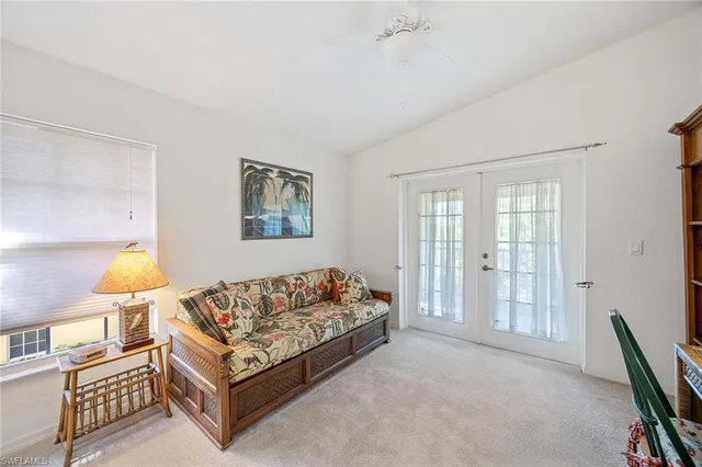 a spacious bedroom with a bed and wooden floor