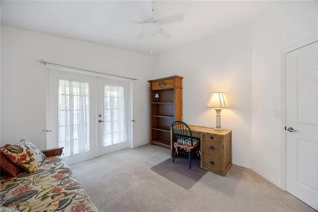 a bedroom with furniture and a lamp