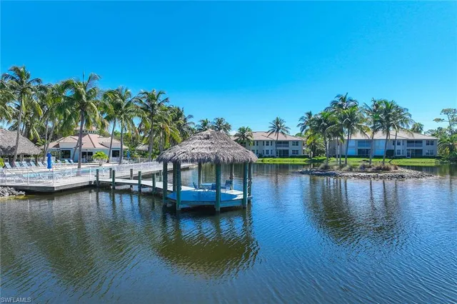 a view of house with outdoor space and lake view