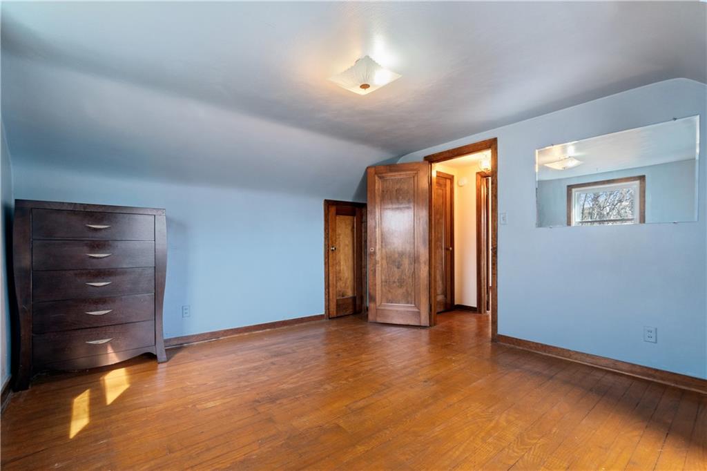 801 Maple Way Oakmont, PA 15139 - Photo 11 of 23 an empty room with closet and wooden floor
