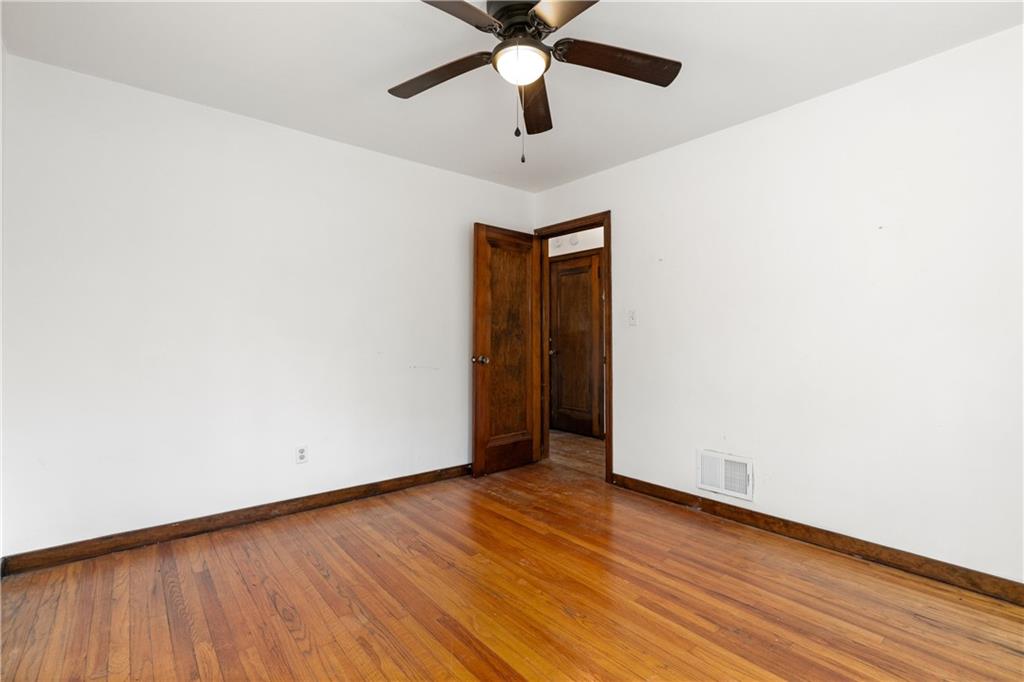 801 Maple Way Oakmont, PA 15139 - Photo 18 of 23 a view of an empty room with wooden floor