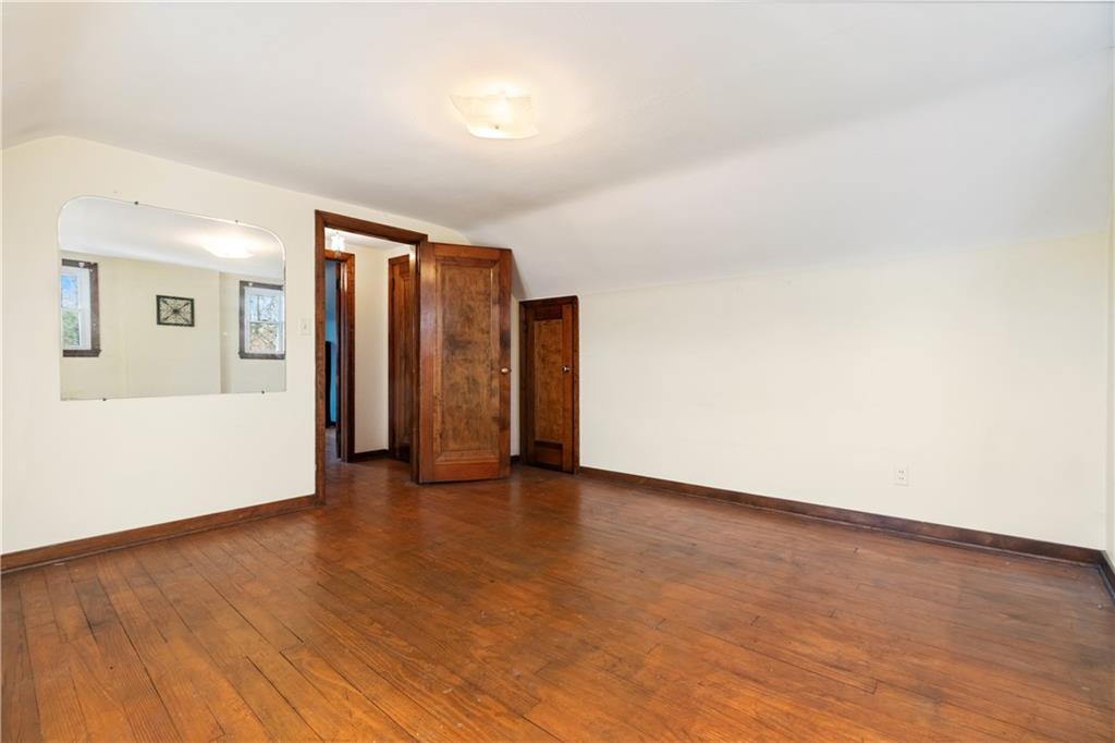 801 Maple Way Oakmont, PA 15139 - Photo 9 of 23 a view of an empty room with wooden floor and closet
