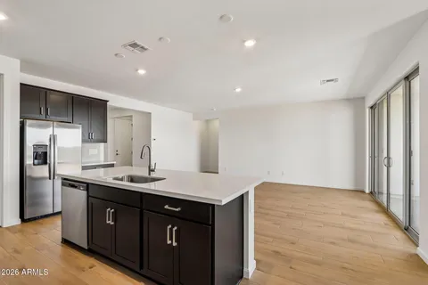 an empty room with a empty space and windows