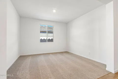 a bedroom with a bed and a cabinet
