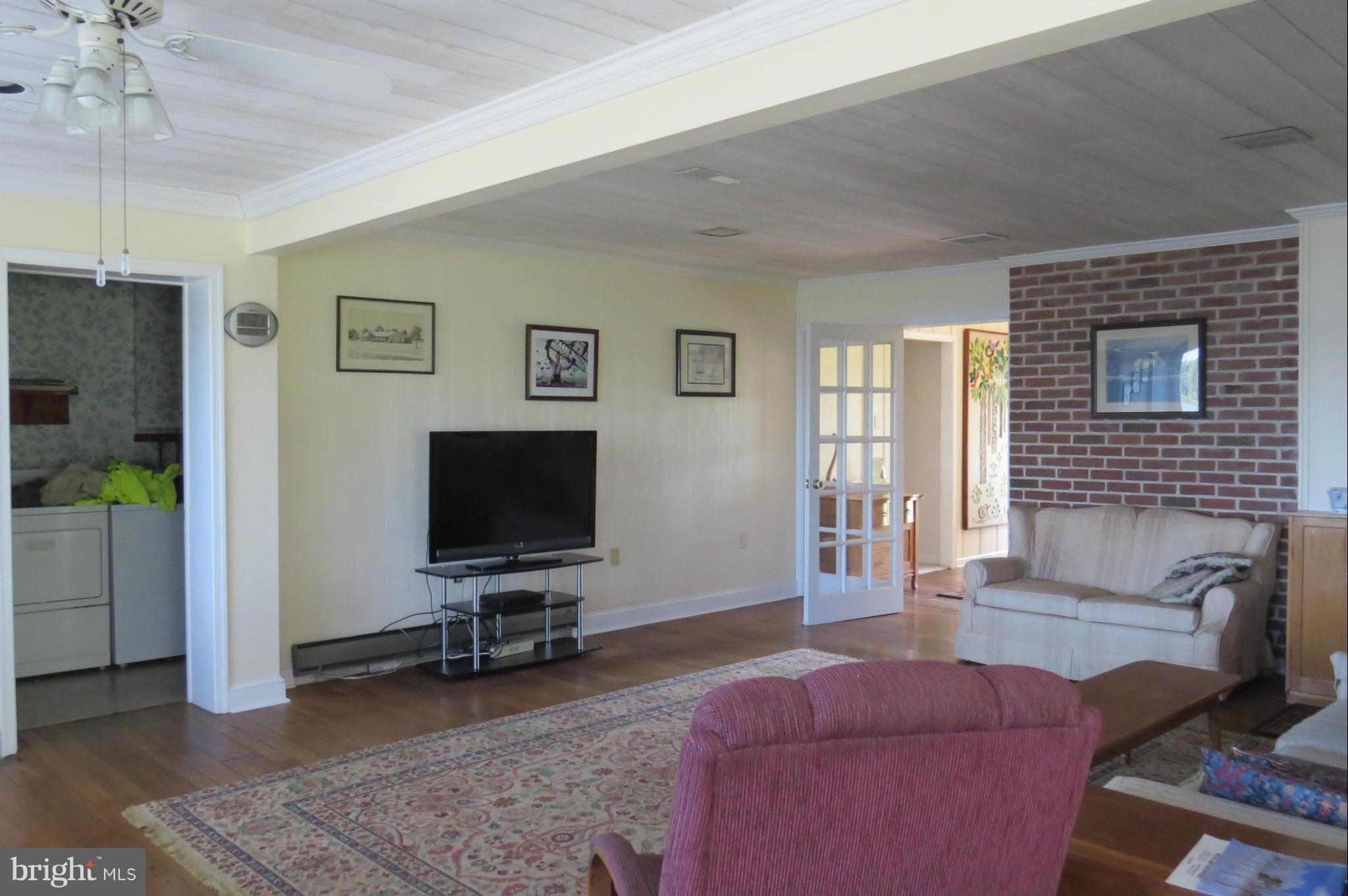 4962 Bar Neck Road Tilghman, MD 21671 - Photo 14 of 30 Family Room with adjacent laundry room