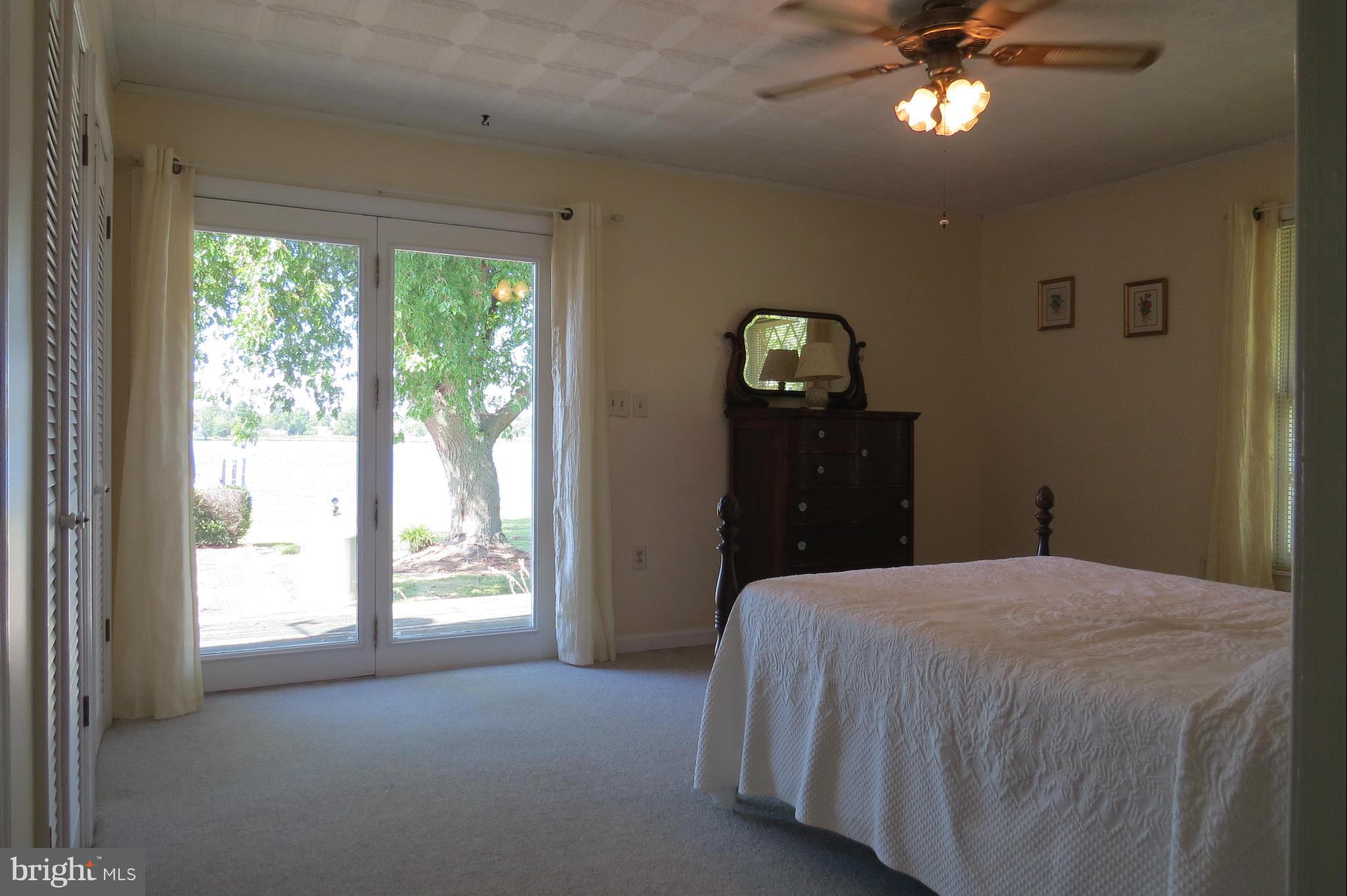 4962 Bar Neck Road Tilghman, MD 21671 - Photo 17 of 30 Bedroom with deck and water views