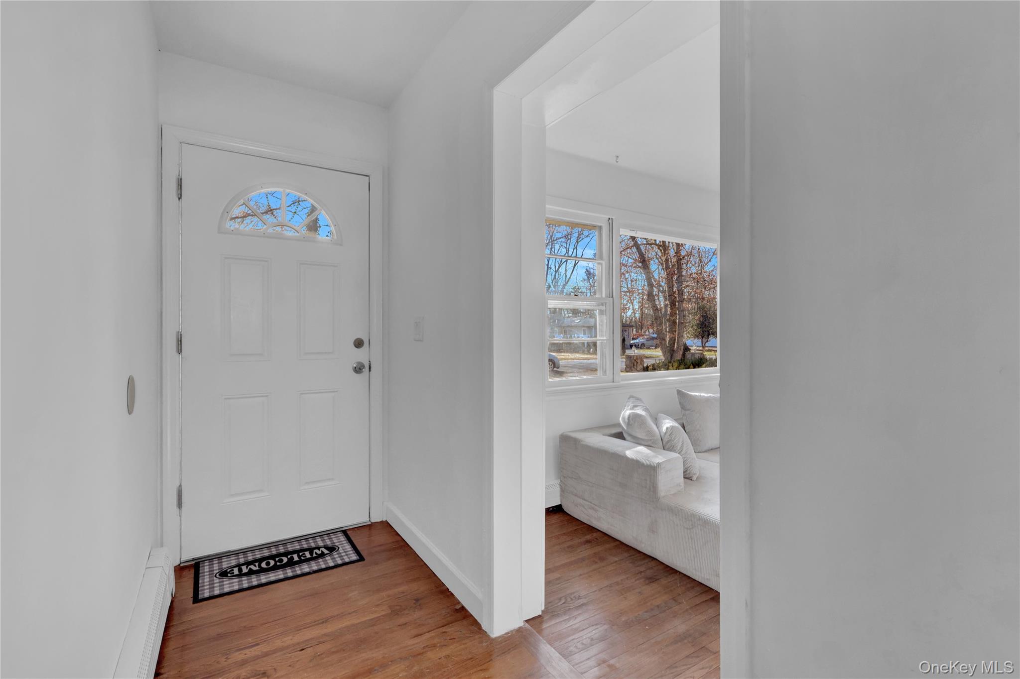 57 Middle Island Road Medford, NY 11763 - Photo 10 of 27 Entrance foyer with light wood-style floors and plenty of natural light