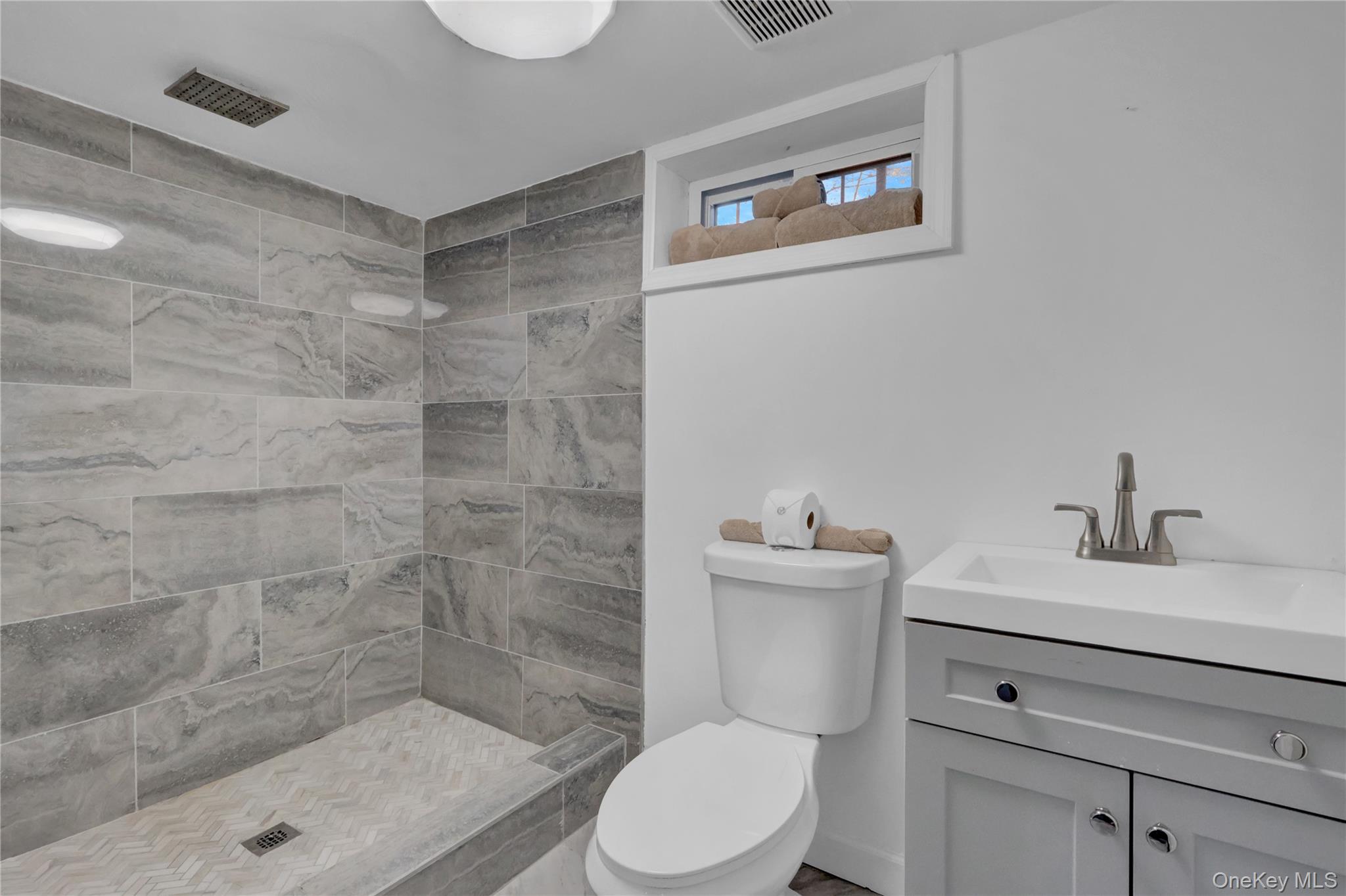 57 Middle Island Road Medford, NY 11763 - Photo 20 of 27 Full bathroom with vanity and tiled shower