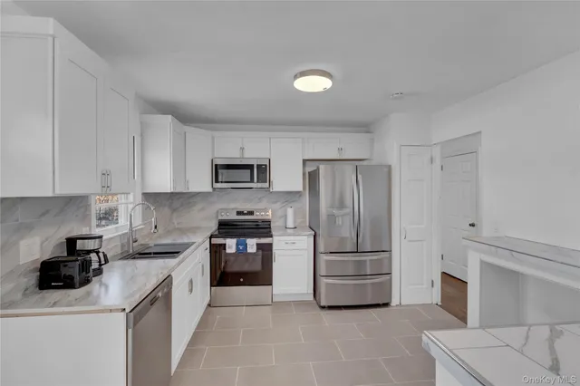 $669,000 | 57 Middle Island Road, Medford, NY 11763