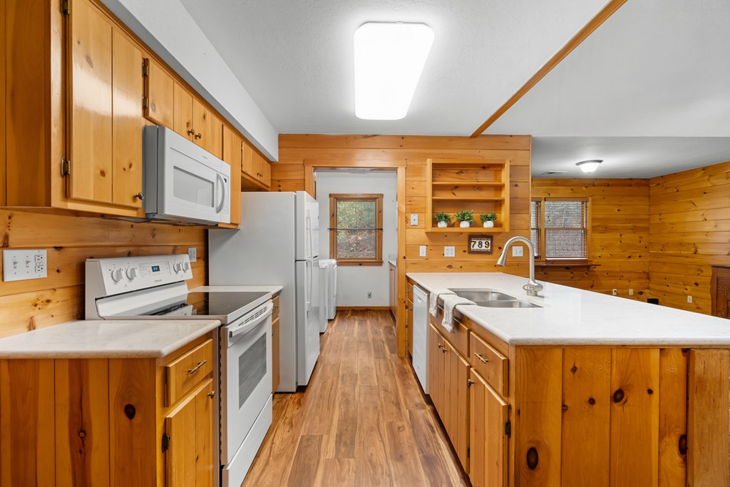 789 Jolley Way Epworth, GA 30541 - Photo 14 of 62 a kitchen with stainless steel appliances granite countertop a sink a stove and a refrigerator