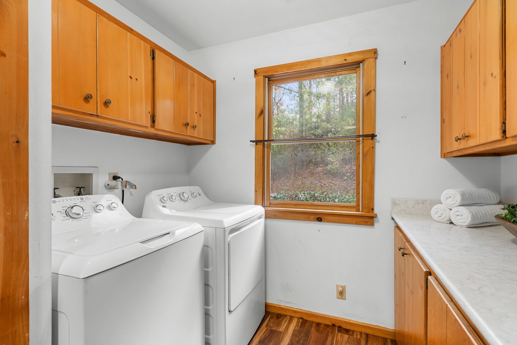 789 Jolley Way Epworth, GA 30541 - Photo 16 of 62 a utility room with dryer and washer
