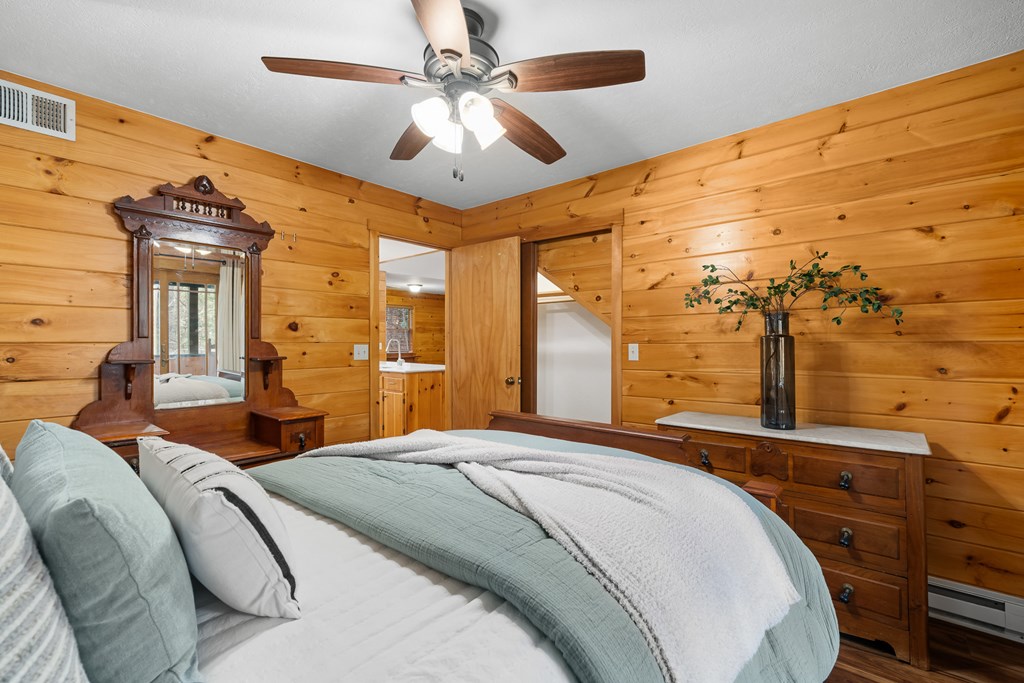 789 Jolley Way Epworth, GA 30541 - Photo 19 of 62 a bedroom with a large bed and ceiling fan