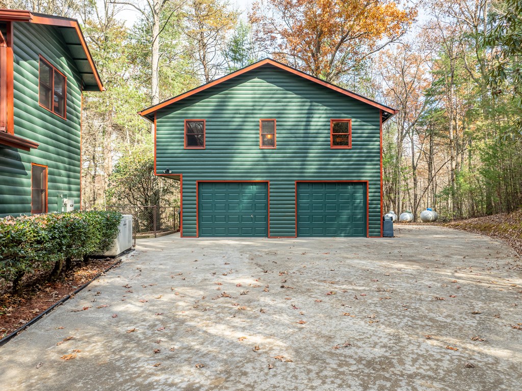 789 Jolley Way Epworth, GA 30541 - Photo 2 of 62 a front view of a house with a yard and garage