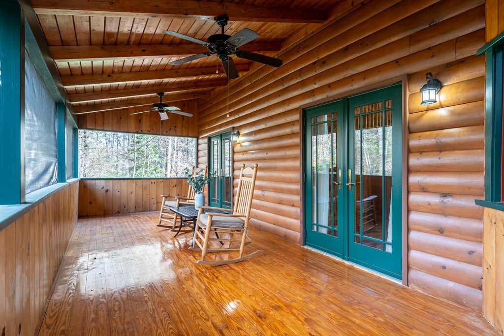 789 Jolley Way Epworth, GA 30541 - Photo 23 of 62 a view of a patio with table and chairs with wooden floor and fence