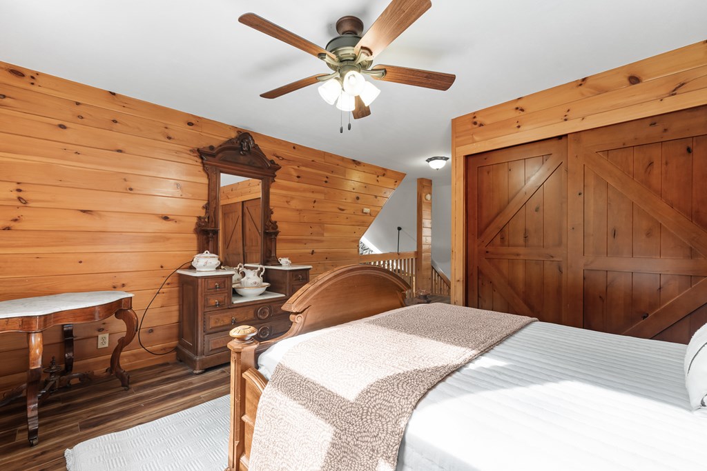 789 Jolley Way Epworth, GA 30541 - Photo 30 of 62 a bedroom with a bed and a chandelier