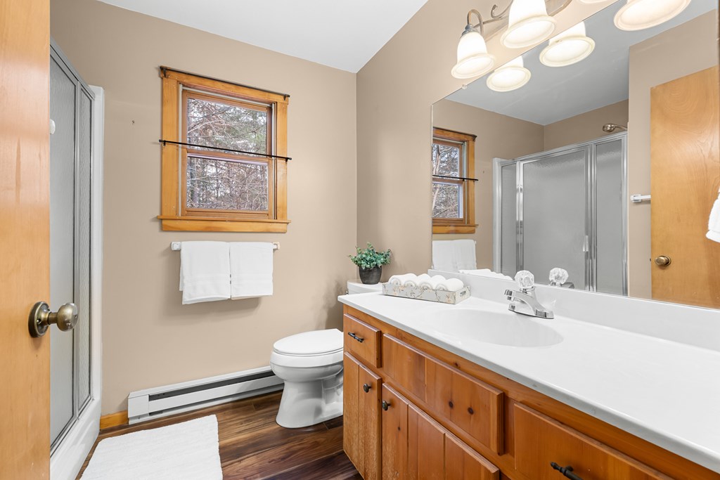 789 Jolley Way Epworth, GA 30541 - Photo 31 of 62 a bathroom with a sink a toilet and a mirror