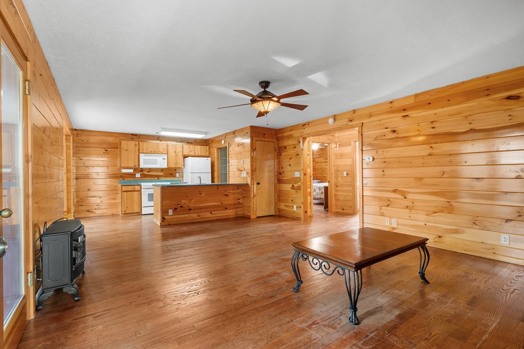789 Jolley Way Epworth, GA 30541 - Photo 38 of 62 a living room with couch table and a table with wooden floor