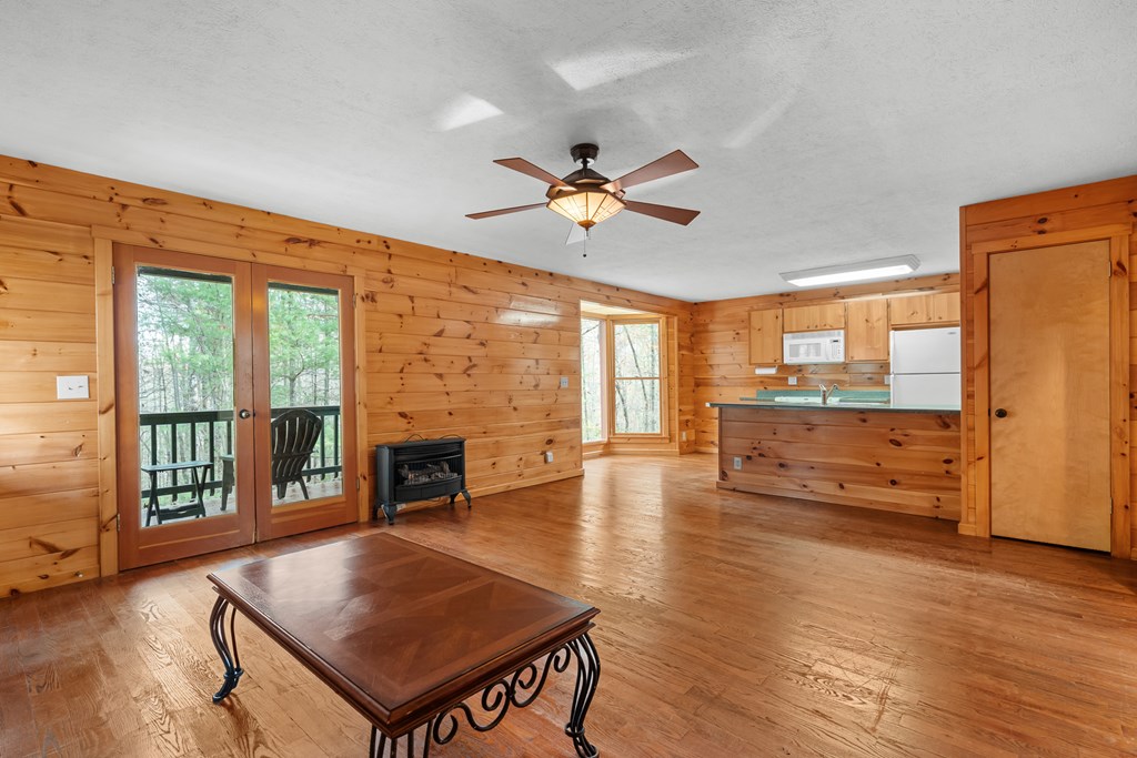 789 Jolley Way Epworth, GA 30541 - Photo 40 of 62 a living room with furniture fireplace and wooden floor