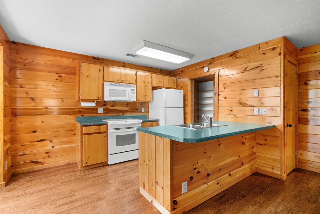 789 Jolley Way Epworth, GA 30541 - Photo 41 of 62 a kitchen with stainless steel appliances granite countertop a stove and a refrigerator