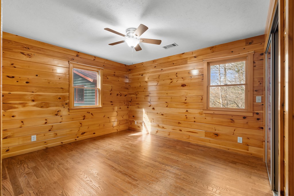 789 Jolley Way Epworth, GA 30541 - Photo 48 of 62 a view of empty room with wooden floor and fan