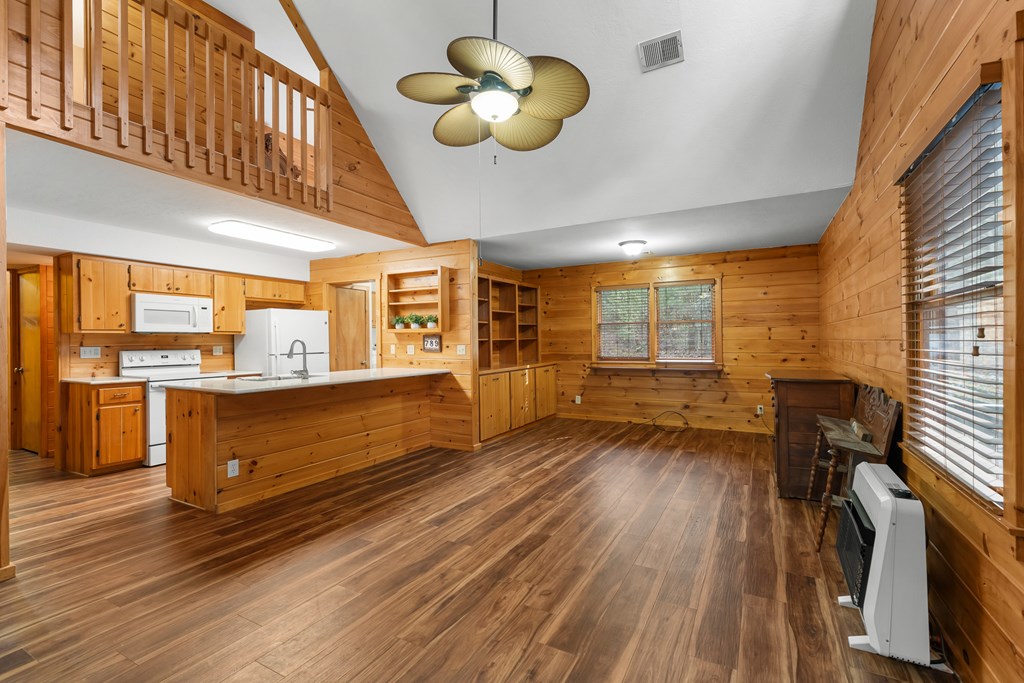 789 Jolley Way Epworth, GA 30541 - Photo 9 of 62 a kitchen with stainless steel appliances granite countertop a stove and wooden floors