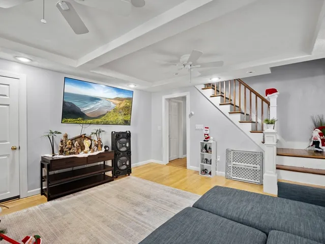 a bedroom with furniture and a flat screen tv