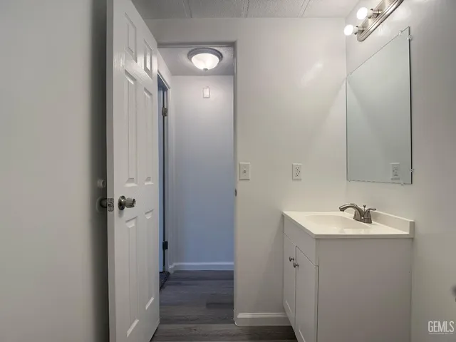 a bathroom with a sink and mirror