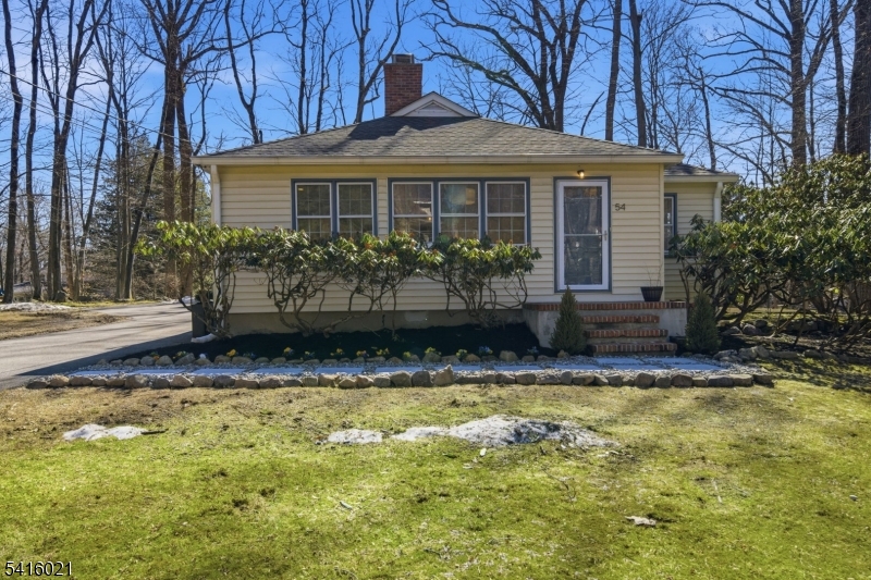 a view of a house with swimming pool and sitting area