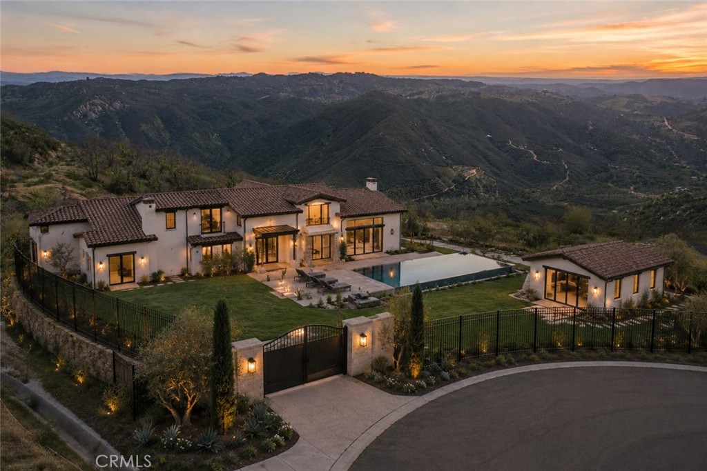0 Crumley Court Temecula, CA 92590 - Photo 2 of 21 an aerial view of a house with swimming pool and mountain view in back