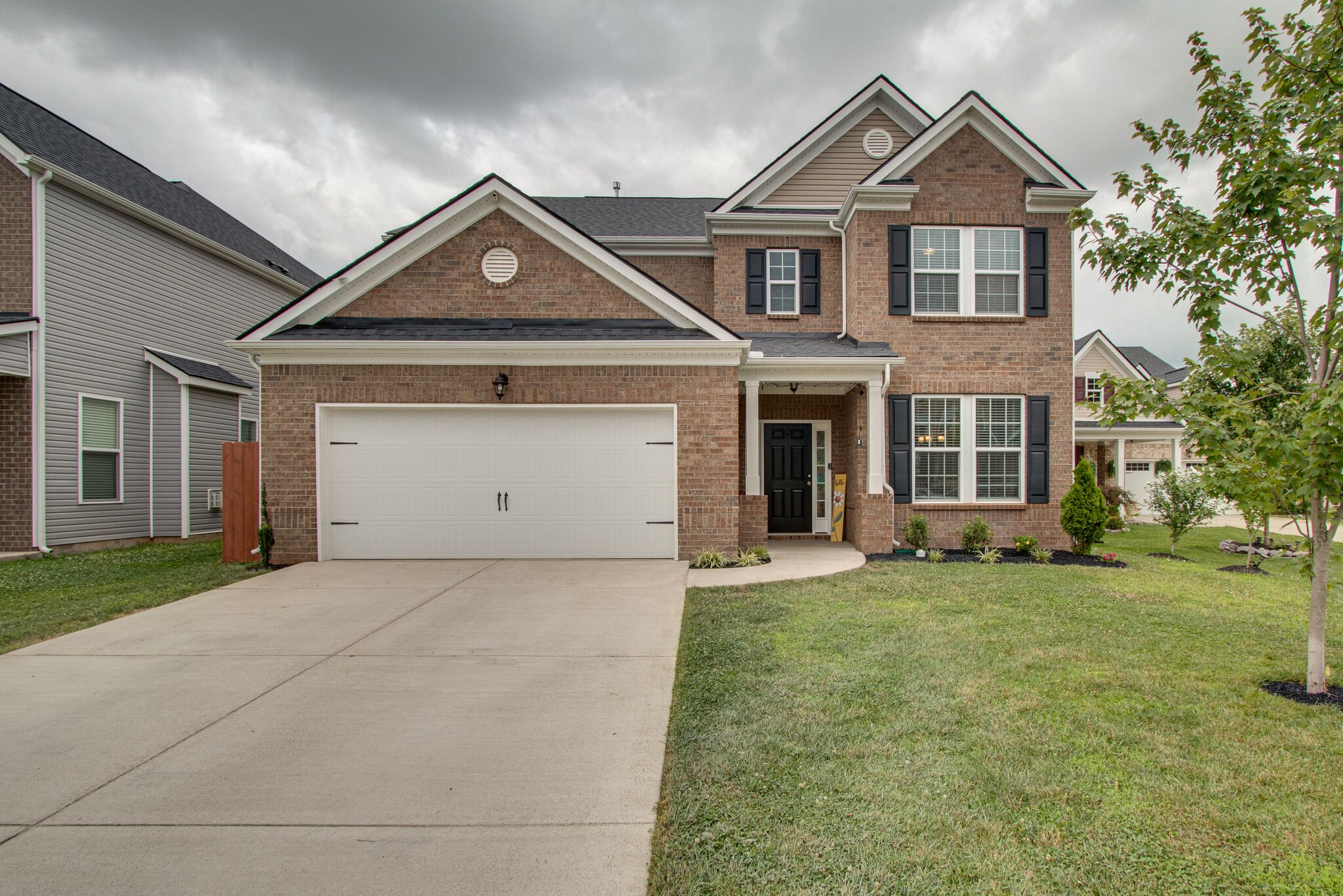 a front view of a house with a yard