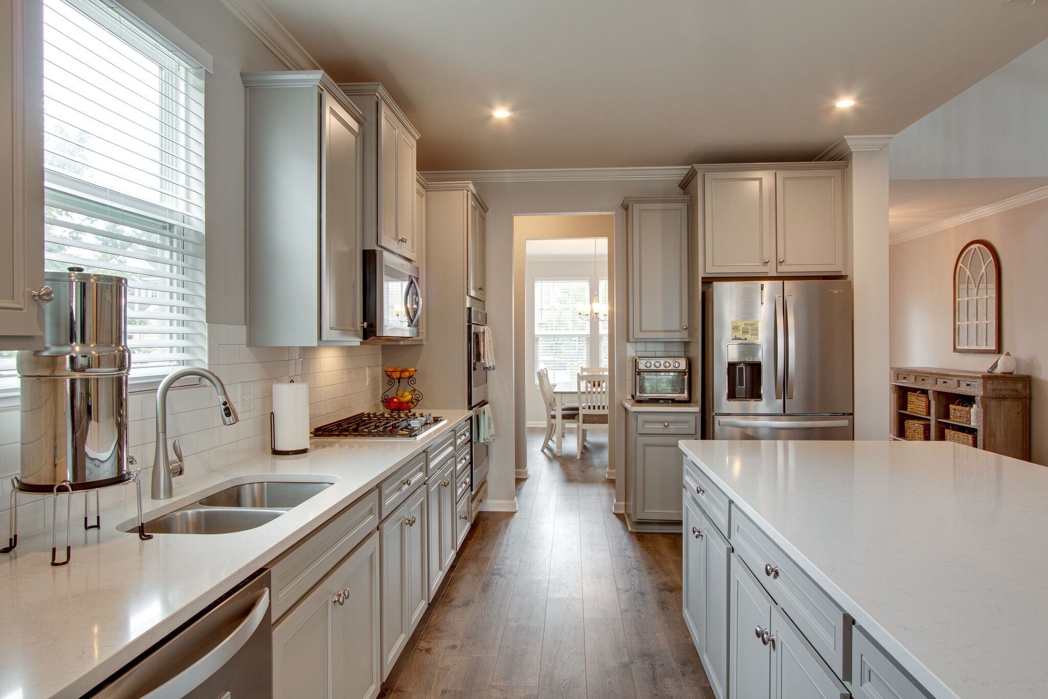 3329 Calendula Way Murfreesboro, TN 37128 - Photo 14 of 48 a large kitchen with stainless steel appliances a sink window and cabinets