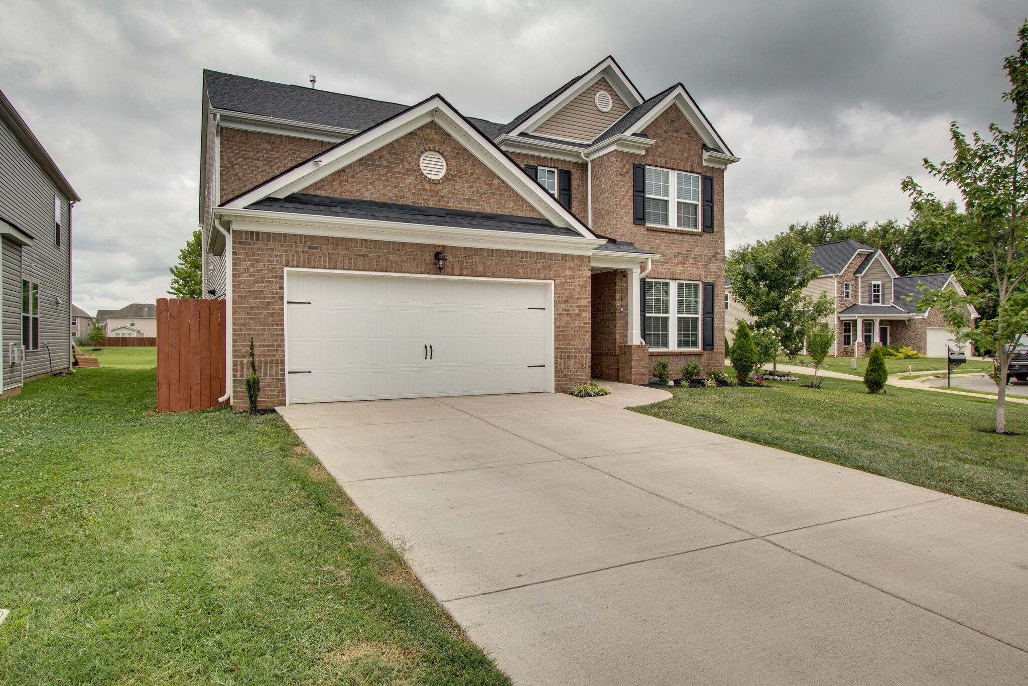 3329 Calendula Way Murfreesboro, TN 37128 - Photo 2 of 48 a front view of a house with a yard and garage