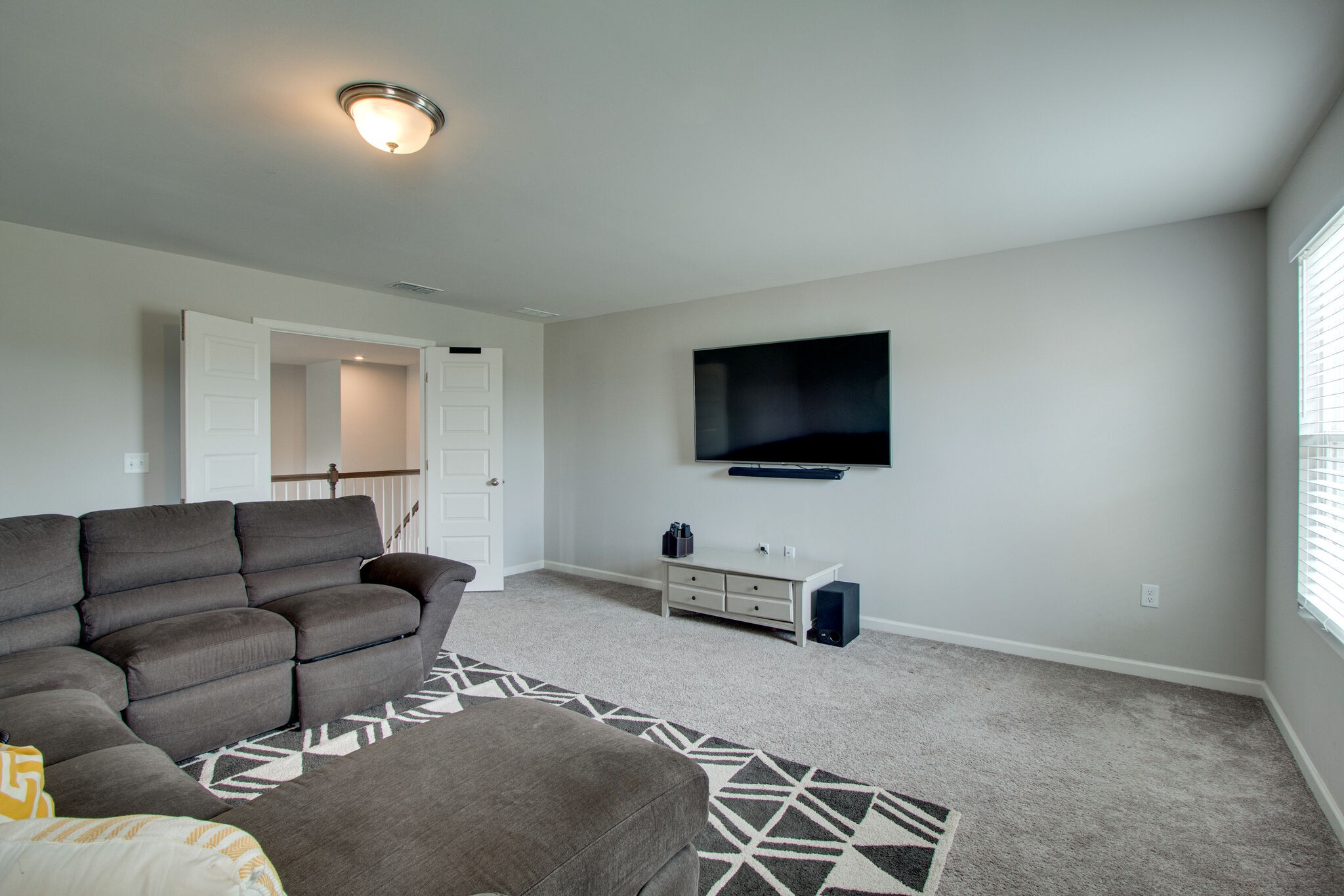 3329 Calendula Way Murfreesboro, TN 37128 - Photo 37 of 48 a living room with furniture and a flat screen tv
