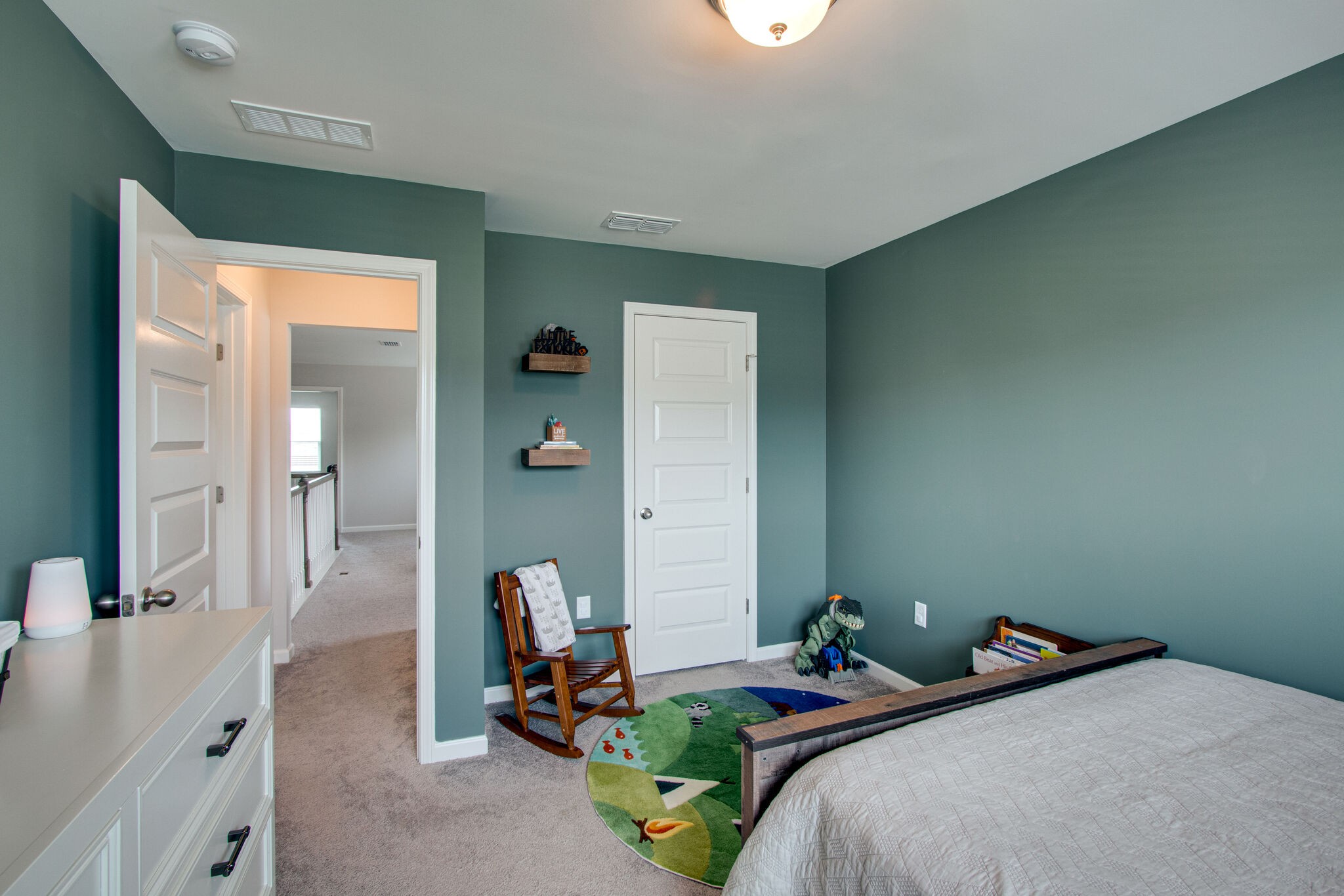 3329 Calendula Way Murfreesboro, TN 37128 - Photo 43 of 48 a bedroom with a bed and a large mirror