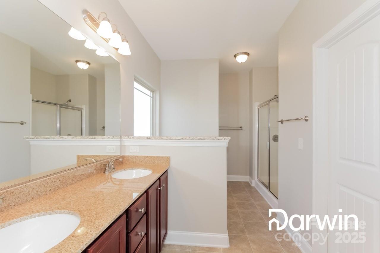 147 Water Ski Drive Statesville, NC 28677 - Photo 6 of 12 a bathroom with a sink vanity granite tub and a mirror