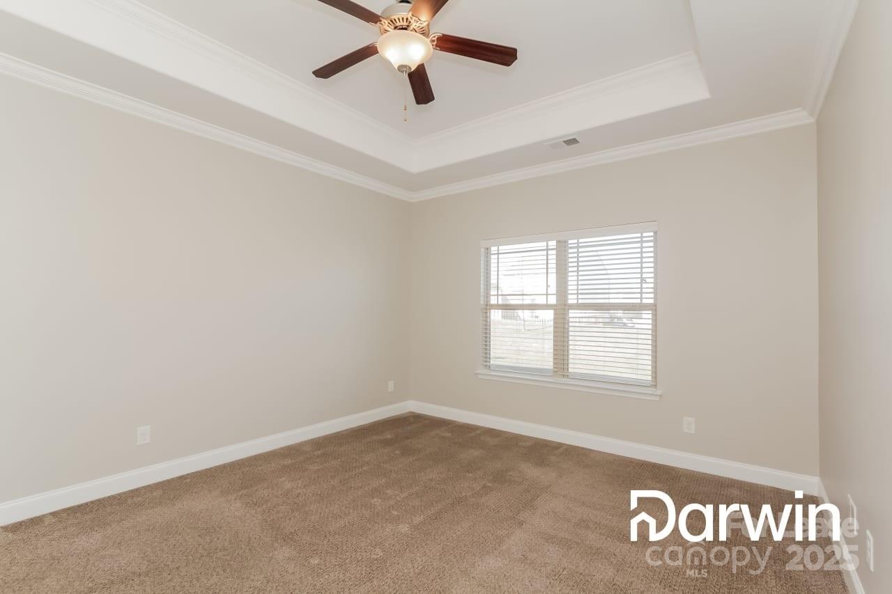 147 Water Ski Drive Statesville, NC 28677 - Photo 9 of 12 an empty room with windows and fan