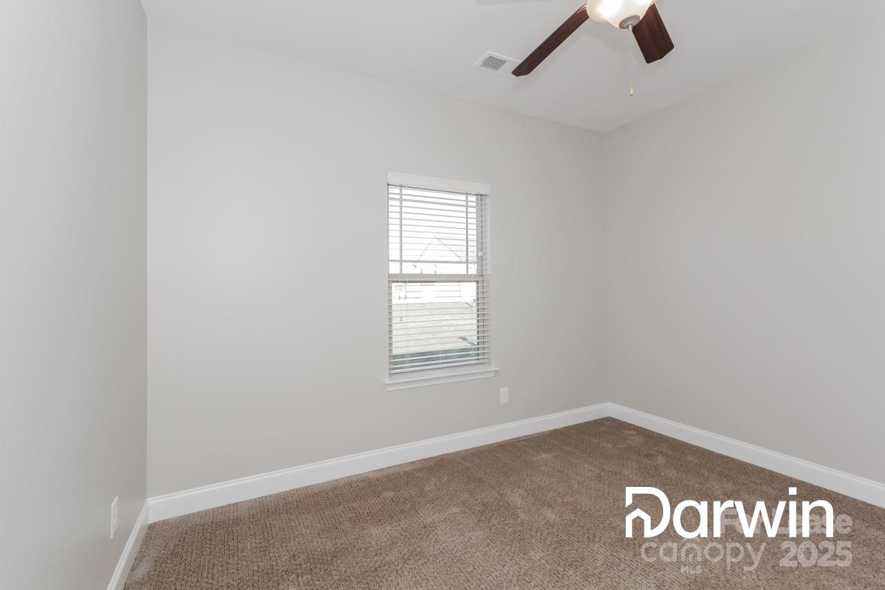 147 Water Ski Drive Statesville, NC 28677 - Photo 10 of 12 an empty room with windows
