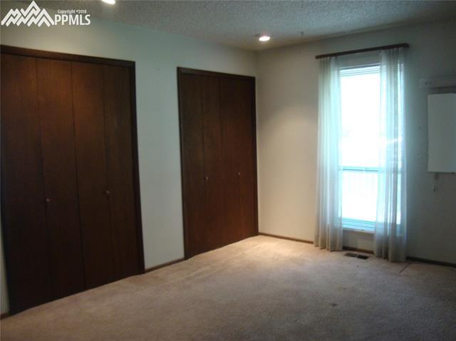2965 Valencia Road Colorado Springs, CO 80917 - Photo 15 of 22 Master bedroom is 14 x 12 with a private bathroom with shower.