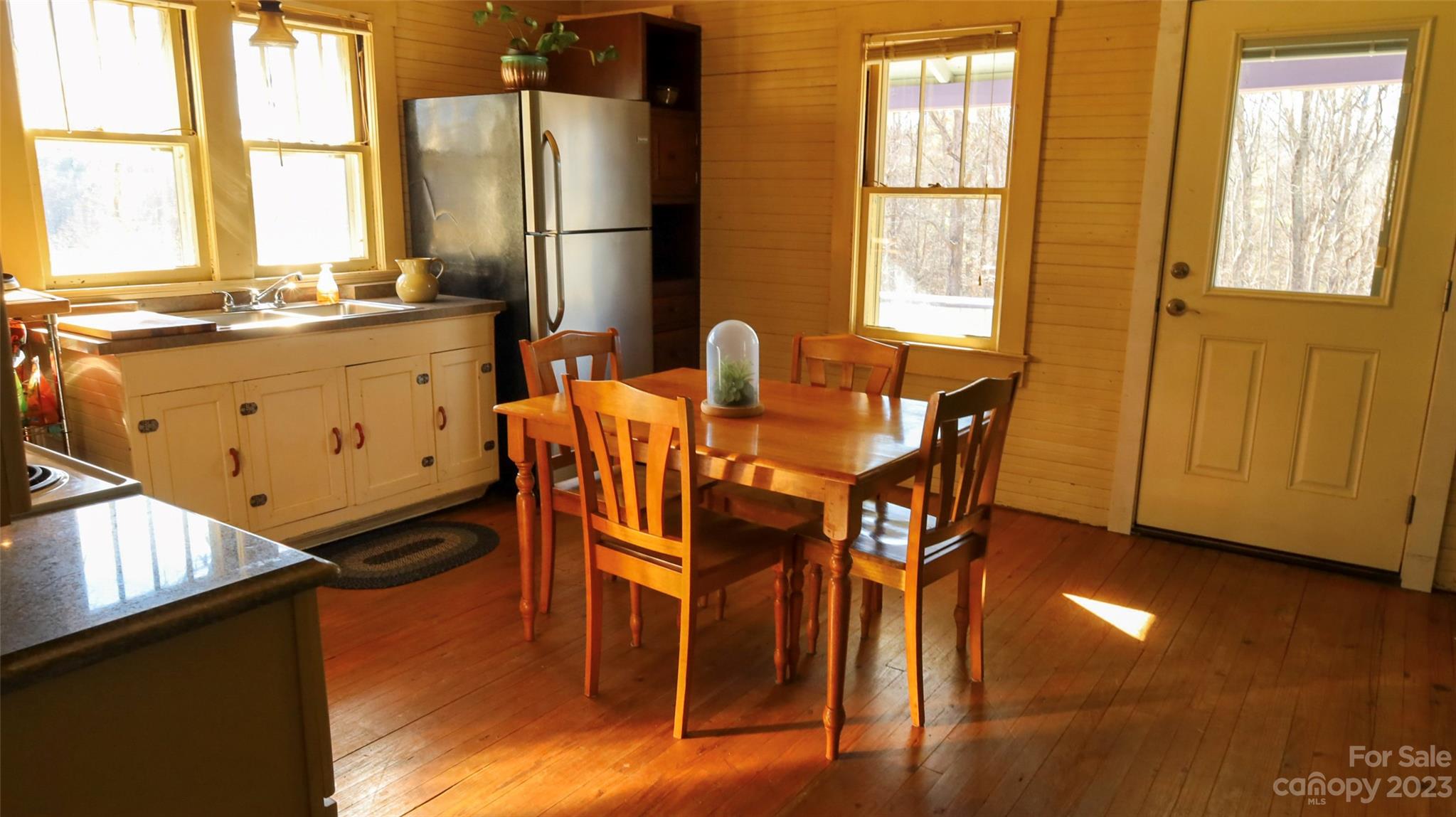 680 Cedar Hill Road Alexander, NC 28701 - Photo 5 of 17 a dining room with furniture window and wooden floor