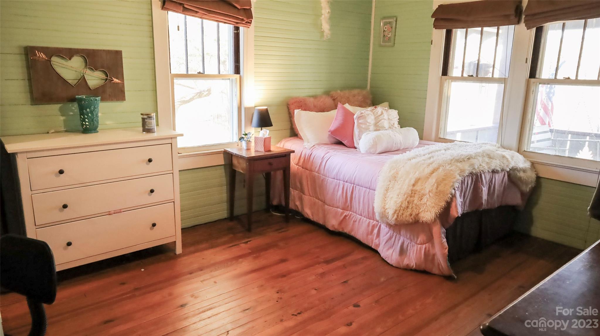 680 Cedar Hill Road Alexander, NC 28701 - Photo 6 of 17 a bedroom with a bed and a dresser next to a window
